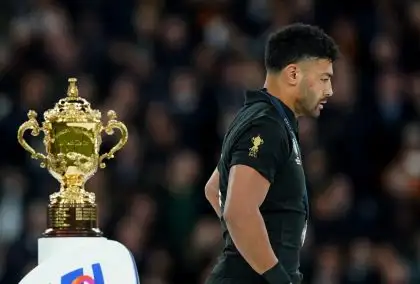 All Blacks flyhalf Richie Mo'unga walks past the Webb Ellis Cup following New Zealand's defeat to South Africa in the Rugby World Cup 2023 final match at the Stade de France in Paris, France