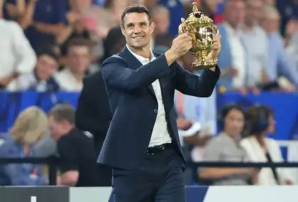All Blacks legend Dan Carter holding the Webb Ellis Cup at the 2023 Rugby World Cup.