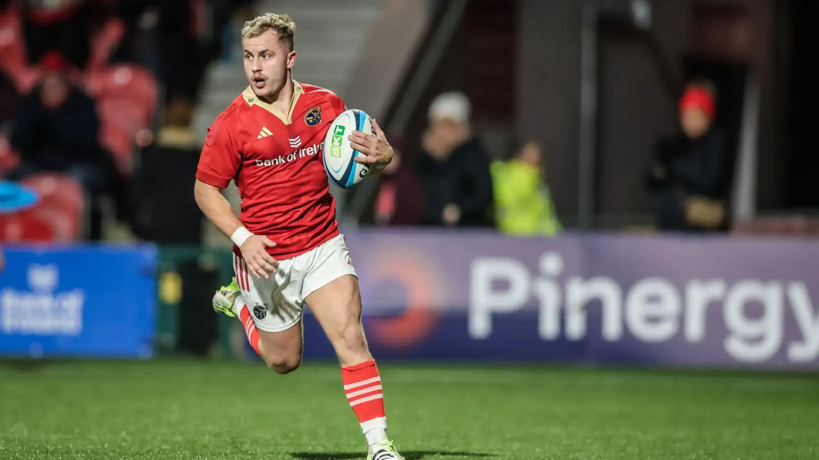 Munster scrum-half Craig Casey with ball in hand.