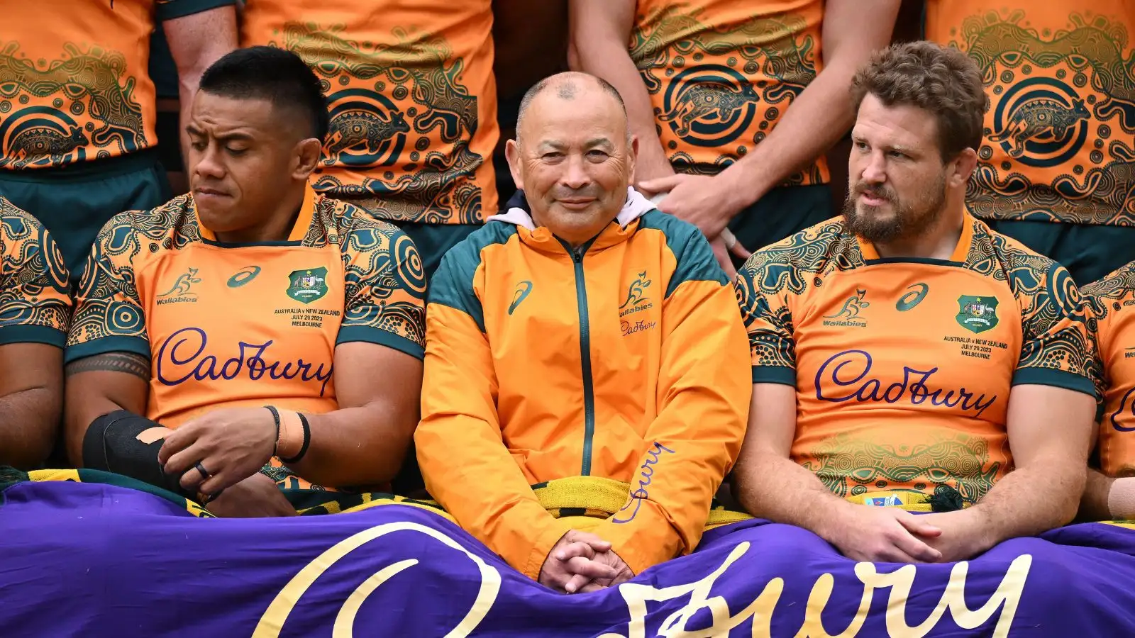 Allan Alaalatoa of the Wallabies, ex-head coach Eddie Jones and James Slipper during a team photo at an Australian Wallabies training session at Brighton Grammar School in Melbourne