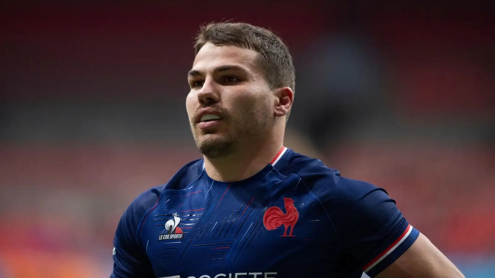 France's Antoine Dupont walks in the try zone after his team scores a try the pitch.