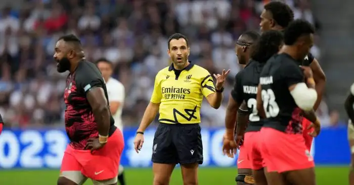 Referee Mathieu Raynal gives directions to platyers during the Rugby World Cup quarterfinal match between England and Fiji at the Stade de Marseille in Marseille, France.