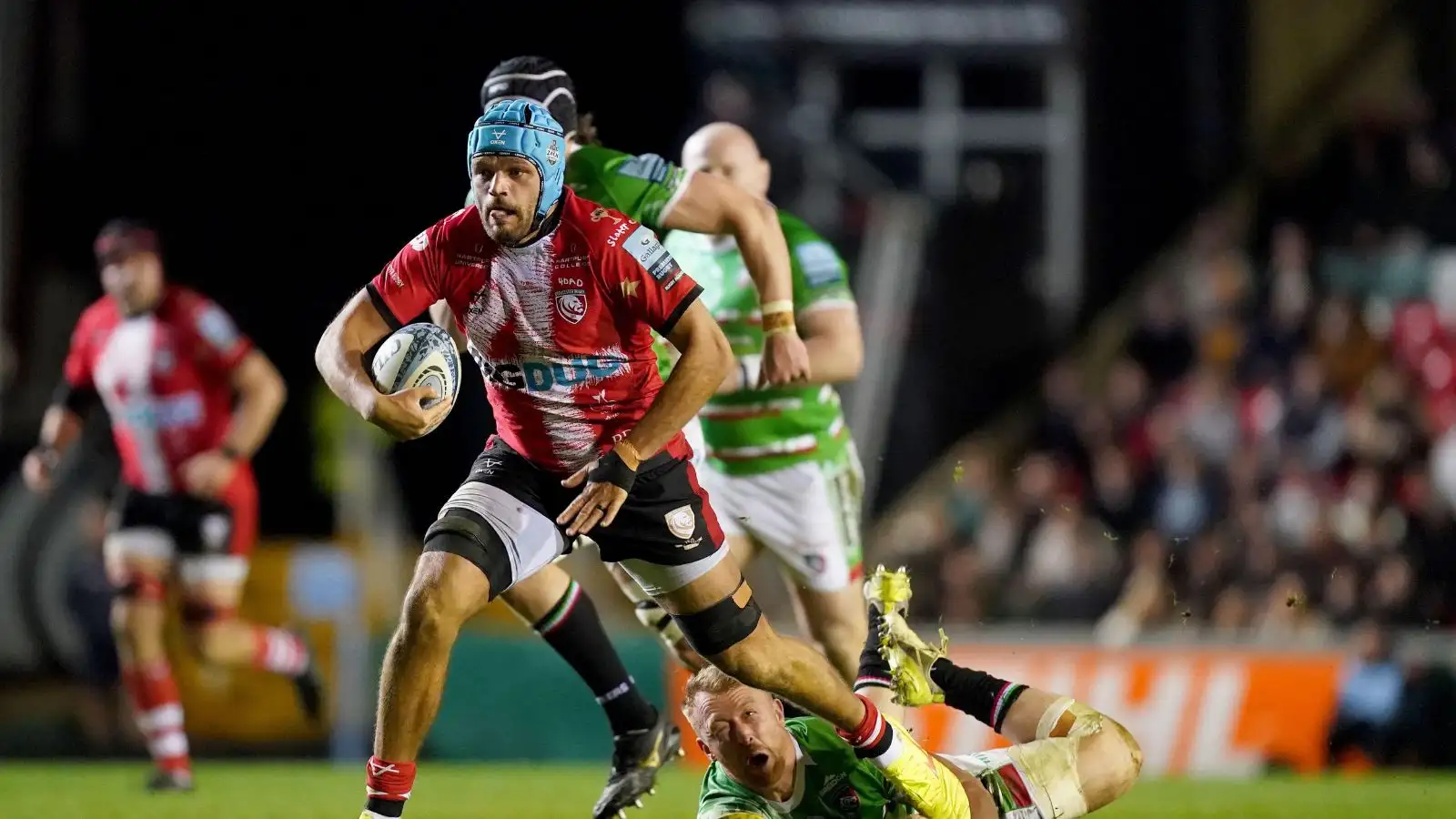 Gloucester's Zach Mercer skips away from a tackle from Leicester Tigers' Tommy Reffell during the Gallagher Premiership match at Mattioli Woods Welford Road Stadium