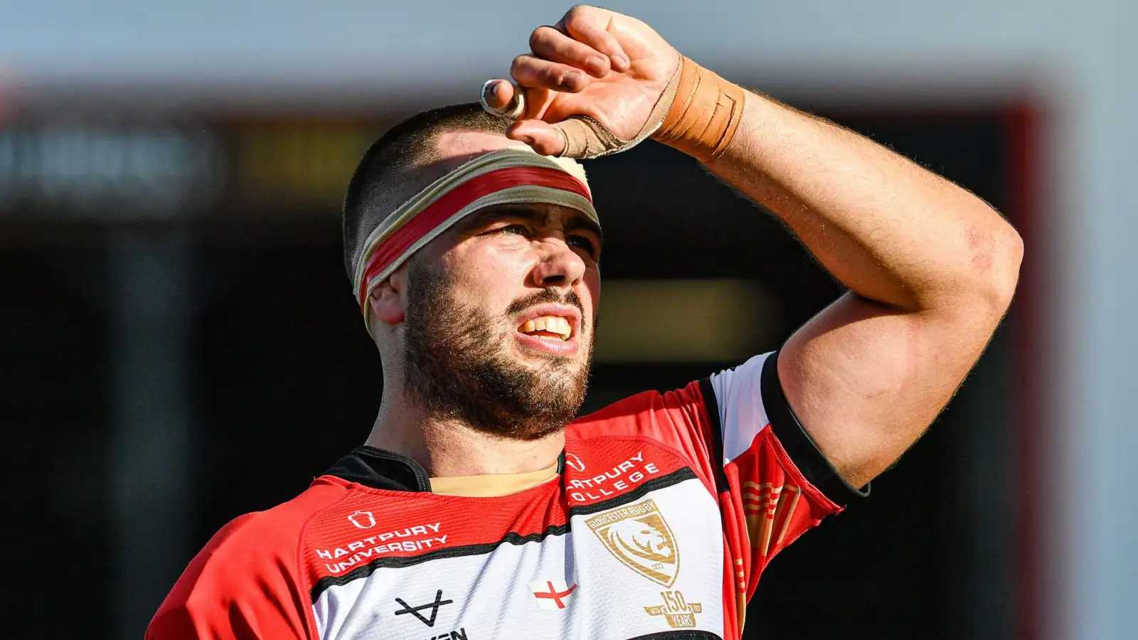 Gloucester skipper Lewis Ludlow looks on.