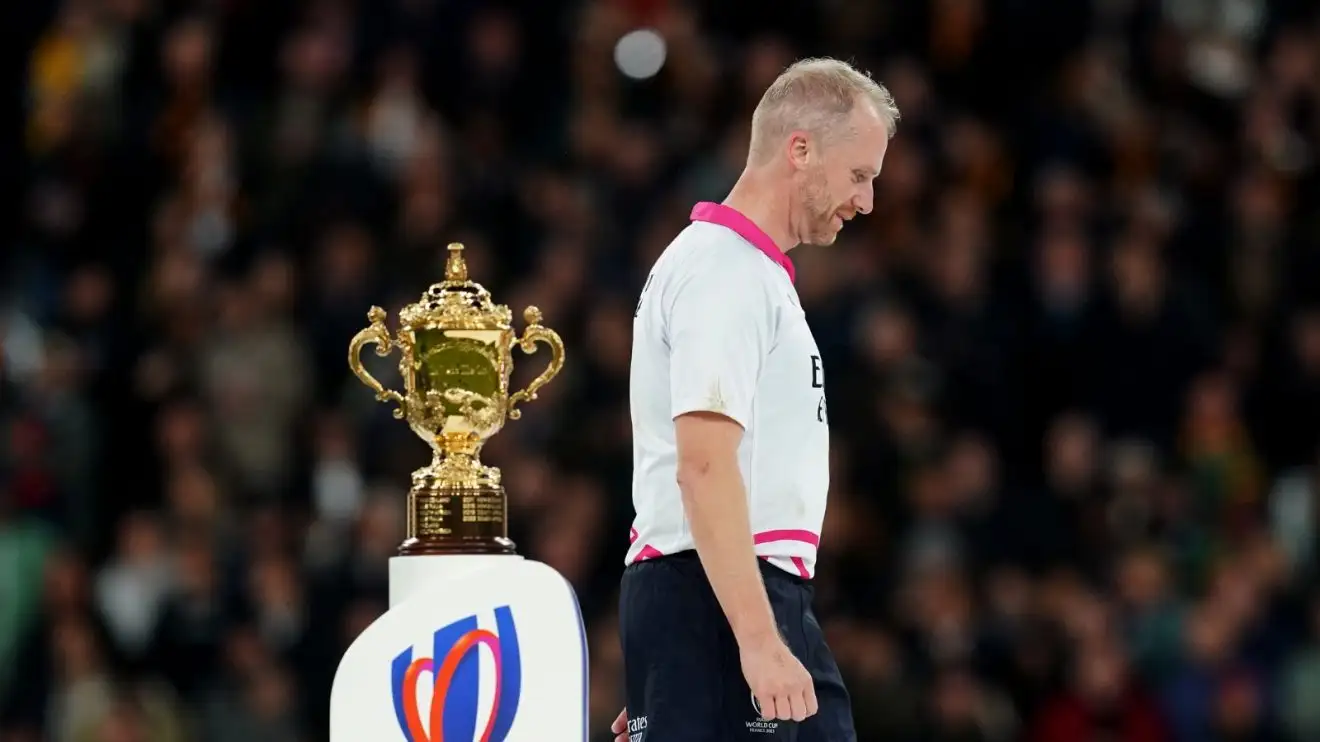 Referee Wayne Barnes walks past the Webb Ellis Cup after the Rugby World Cup final between New Zealand and South Africa.