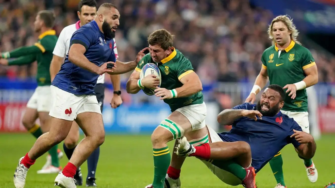 South Africa's Kwagga Smith is tackled by France’s Uini Atonio and Reda Wardi during the Rugby World Cup 2023 quarter final match at the Stade de France, Saint-Denis.