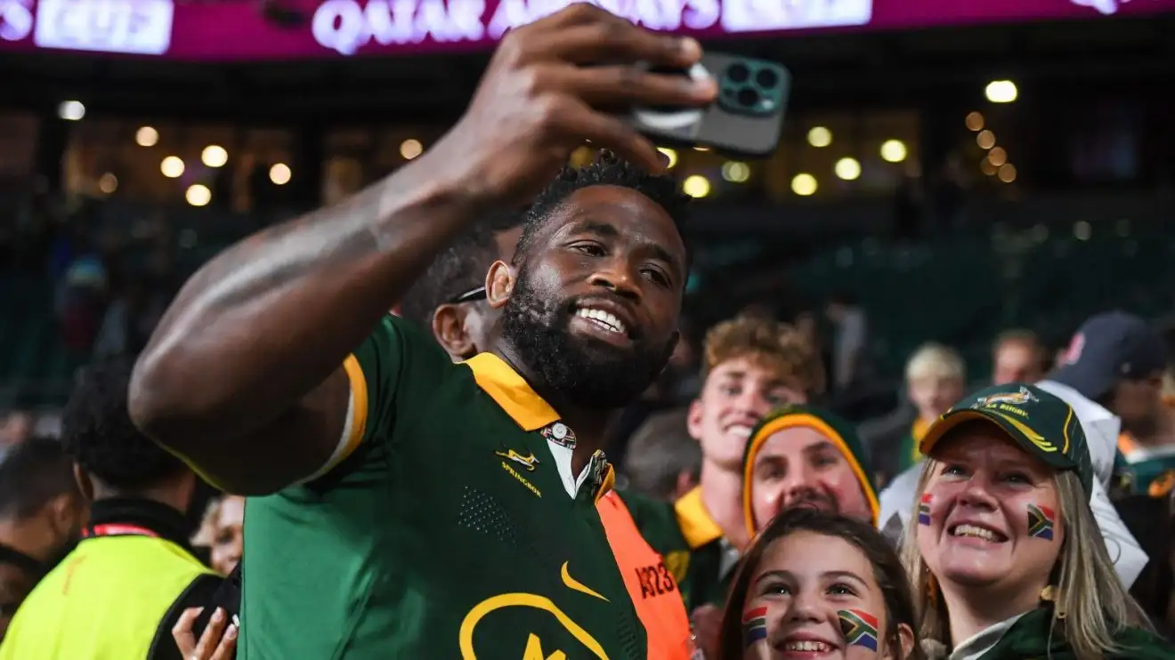 Springboks Siya Kolisi takes a selfie with fans.
