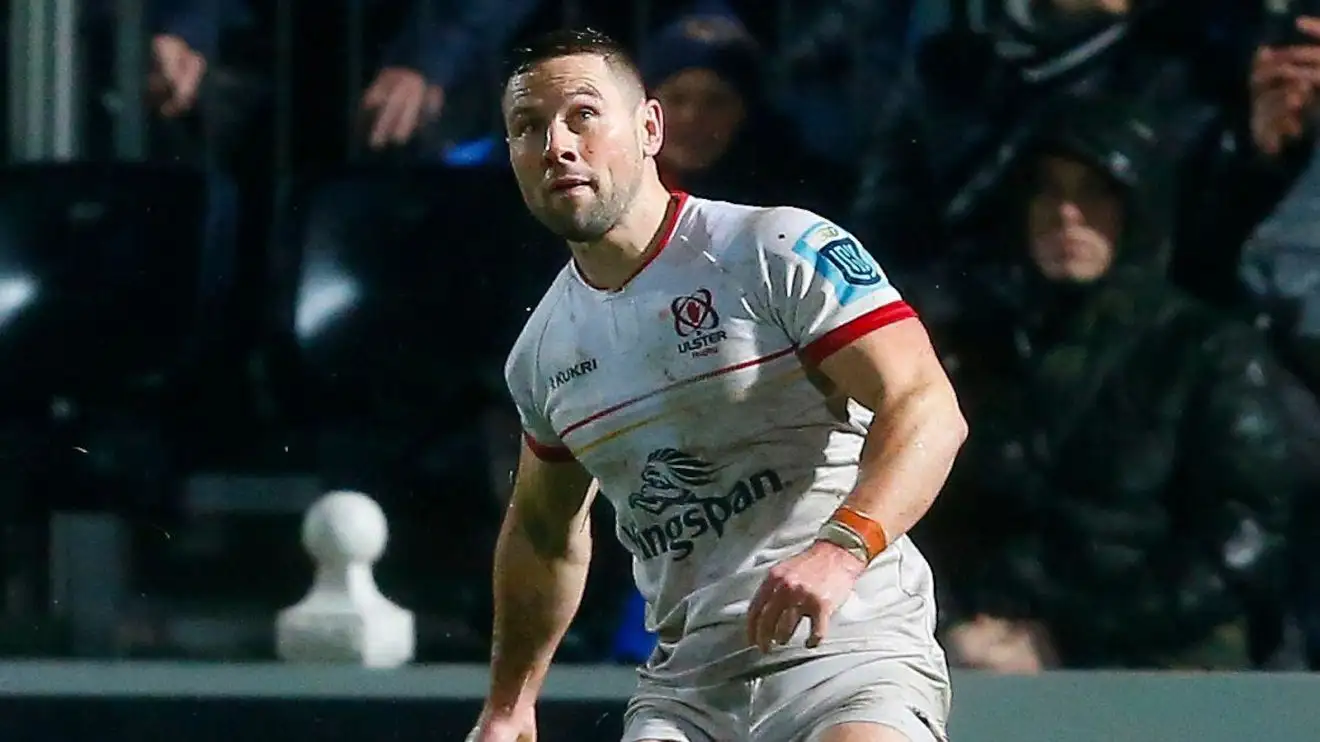 Ulster scrum-half John Cooney kicking.