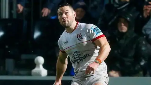 Ulster scrum-half John Cooney kicking.