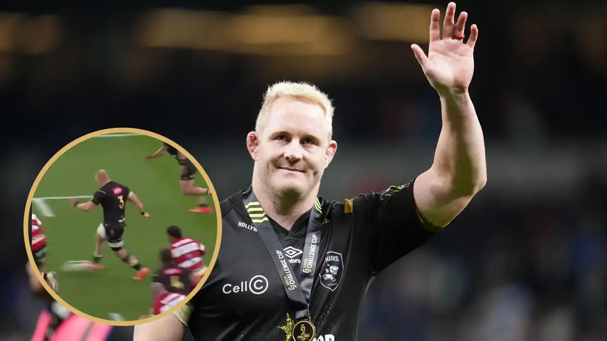 Sharks prop Vincent Koch waves to fans.