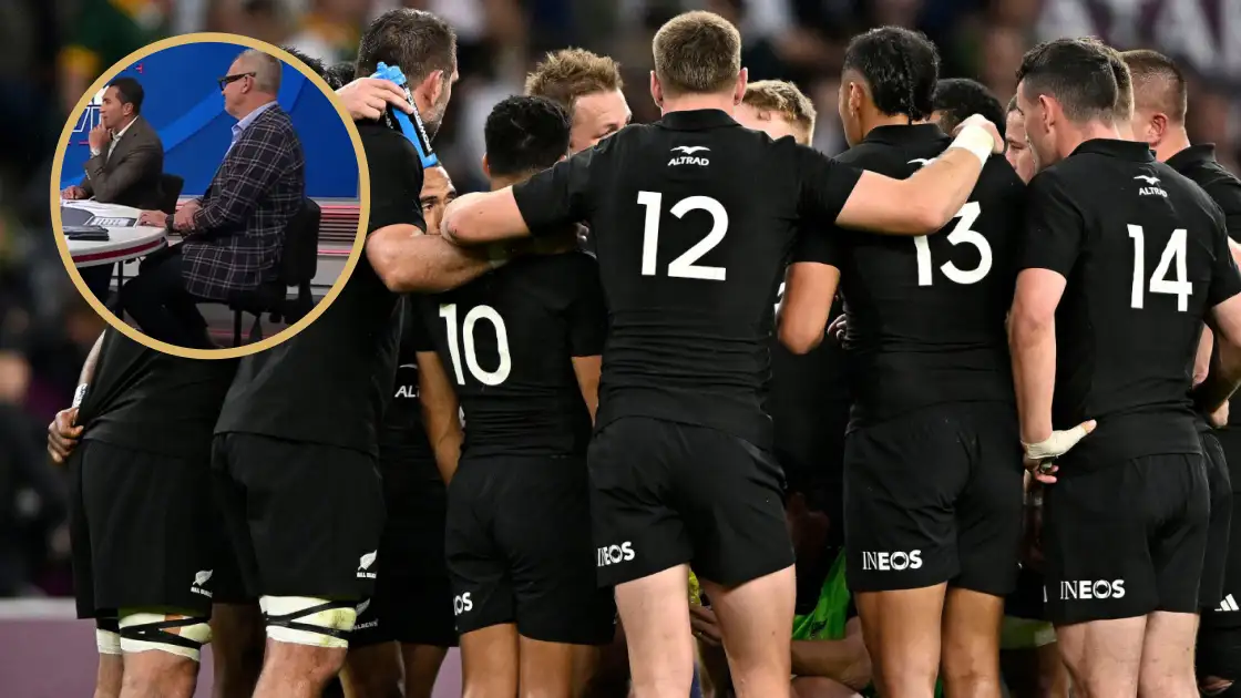 All Blacks players in a huddle alongside The Breakdown panel.