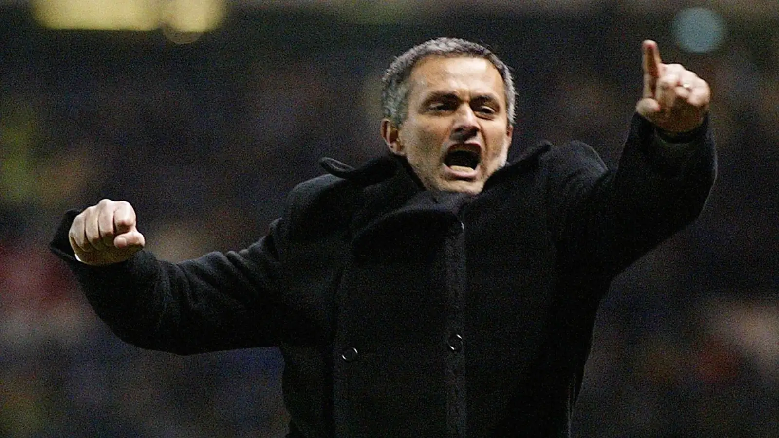 Jose Mourinho celebrates his Porto team's late goal in the Champions League game against Manchester United at Old Trafford, Manchester. 9 March 2004.