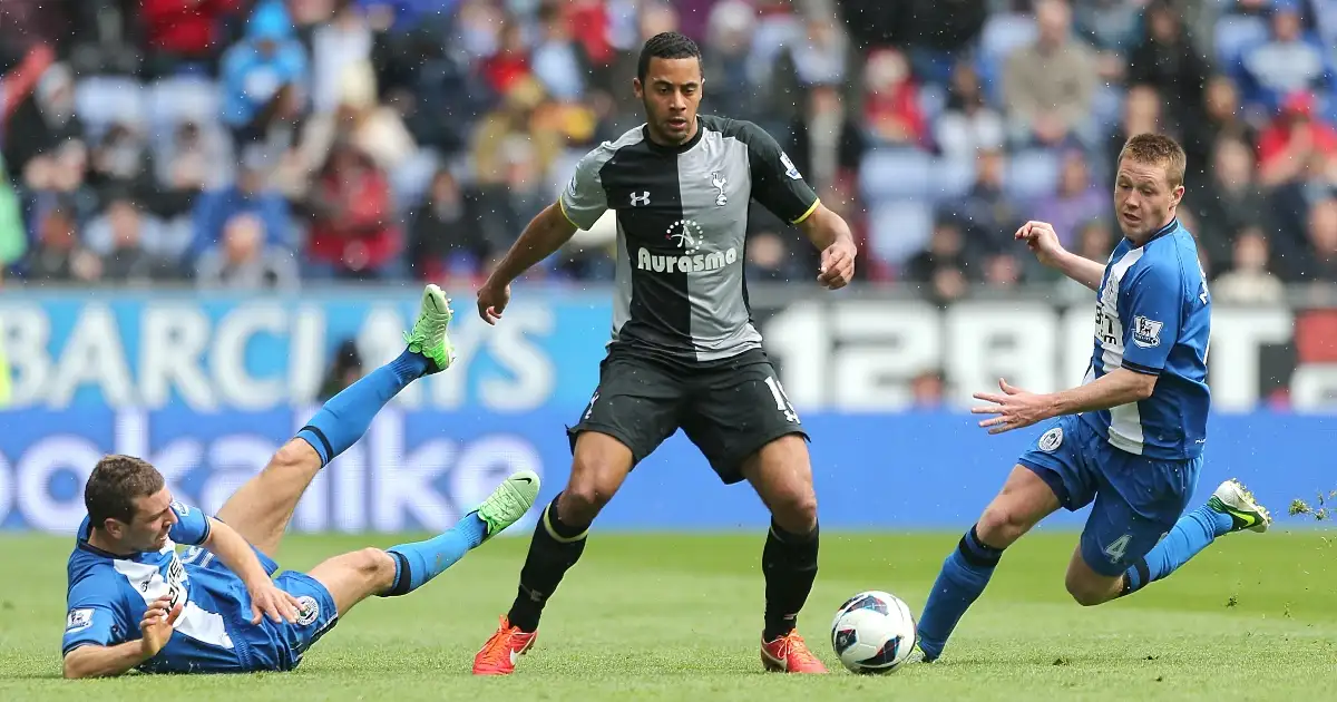 Tottenham Hotspur's Mousa Dembele (centre) shrugs of the challenges of Wigan Athletic's James McCarthy (right) and Callum McManaman. 27 April 2013.