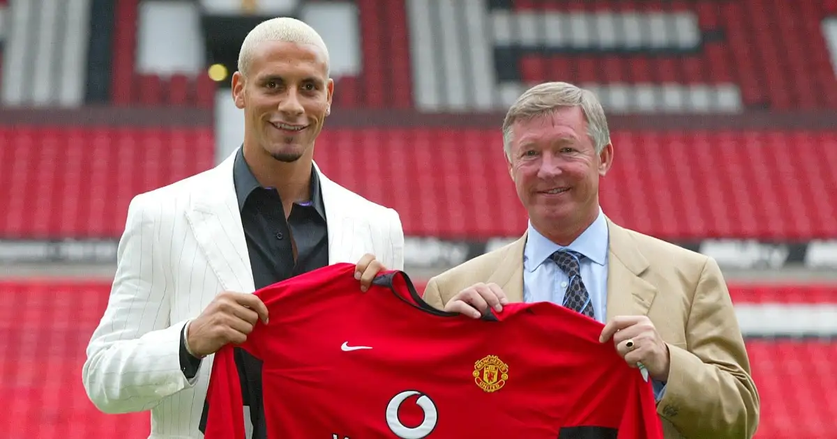 Sir Alex Ferguson and Rio Ferdinand pose with a Manchester United shirt at Old Trafford, Manchester, England. July 2002.