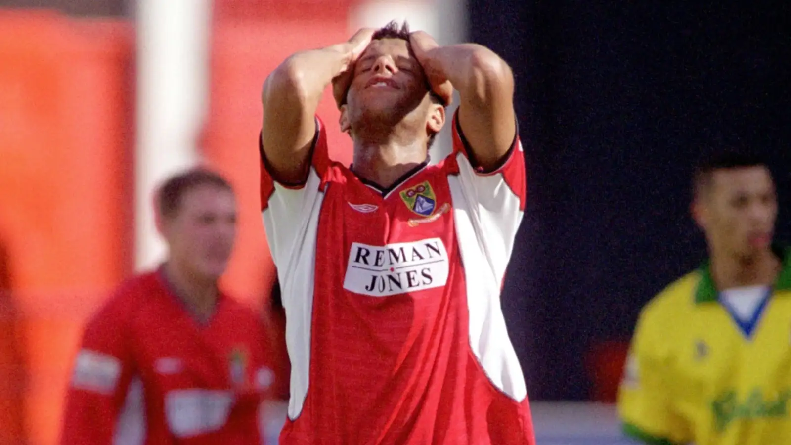 Morecambe's Julian Dowe holds his head in despair after missing a great chance