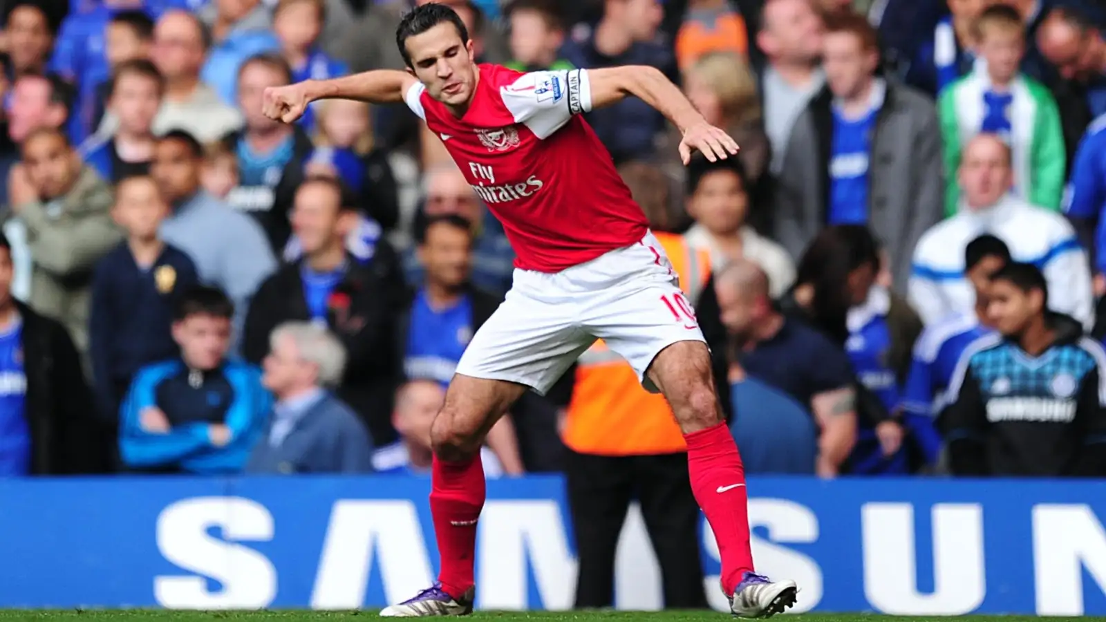 Arsenal captain Robin van Persie celebrates scoring in their famous Premier League win against Chelsea at Stamford Bridge, London, October 2011.