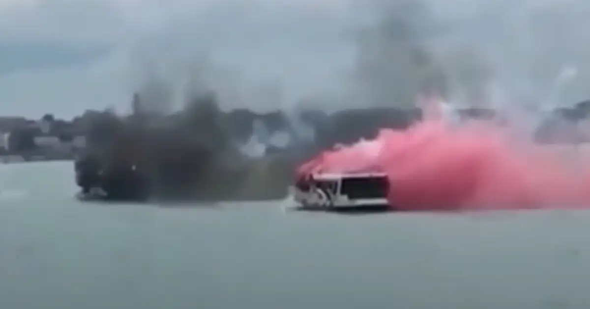 Venezia and AC Milan fans fire fireworks at each other while taking the ferry to the Venezia stadium. Venice, January 2022.