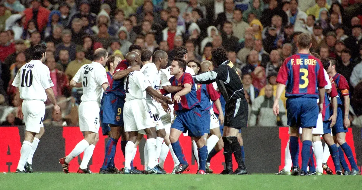 Barcelona and Real Madrid players scrap during their La Liga match at Bernabeu Stadium, Madrid, April 2003.