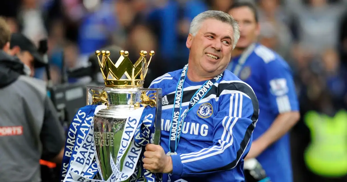 Chelsea's Carlo Ancelotti celebrates with the Premier League title. Stamford Bridge, May 2010.