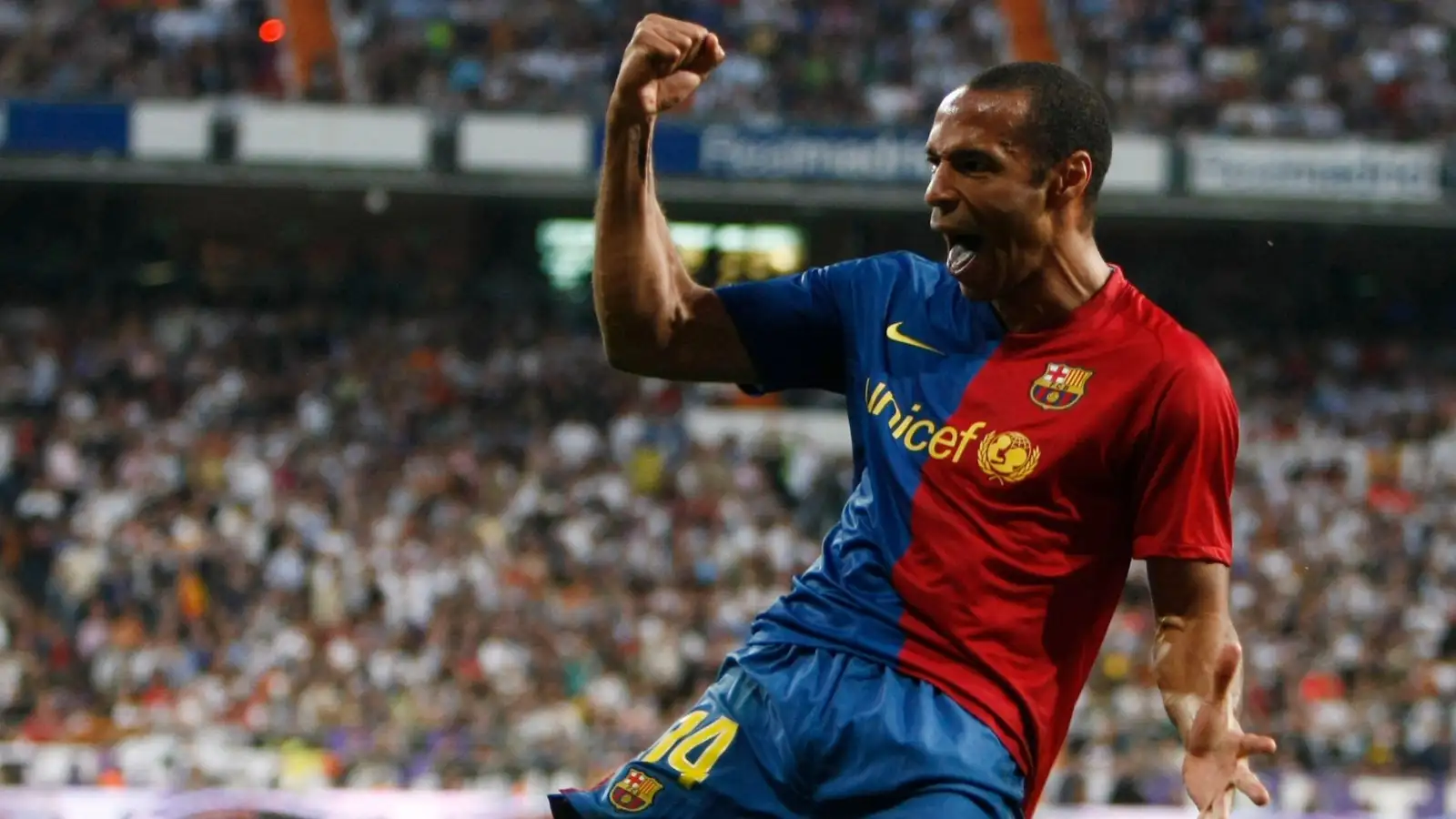 Thierry Henry celebrates scoring for Barcelona against Real Madrid at Santiago Bernabeu, Madrid, May 2009.