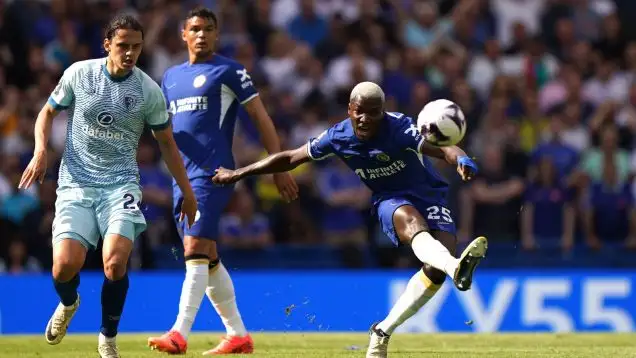 Moises Caicedo scores from the halfway line for Chelsea.