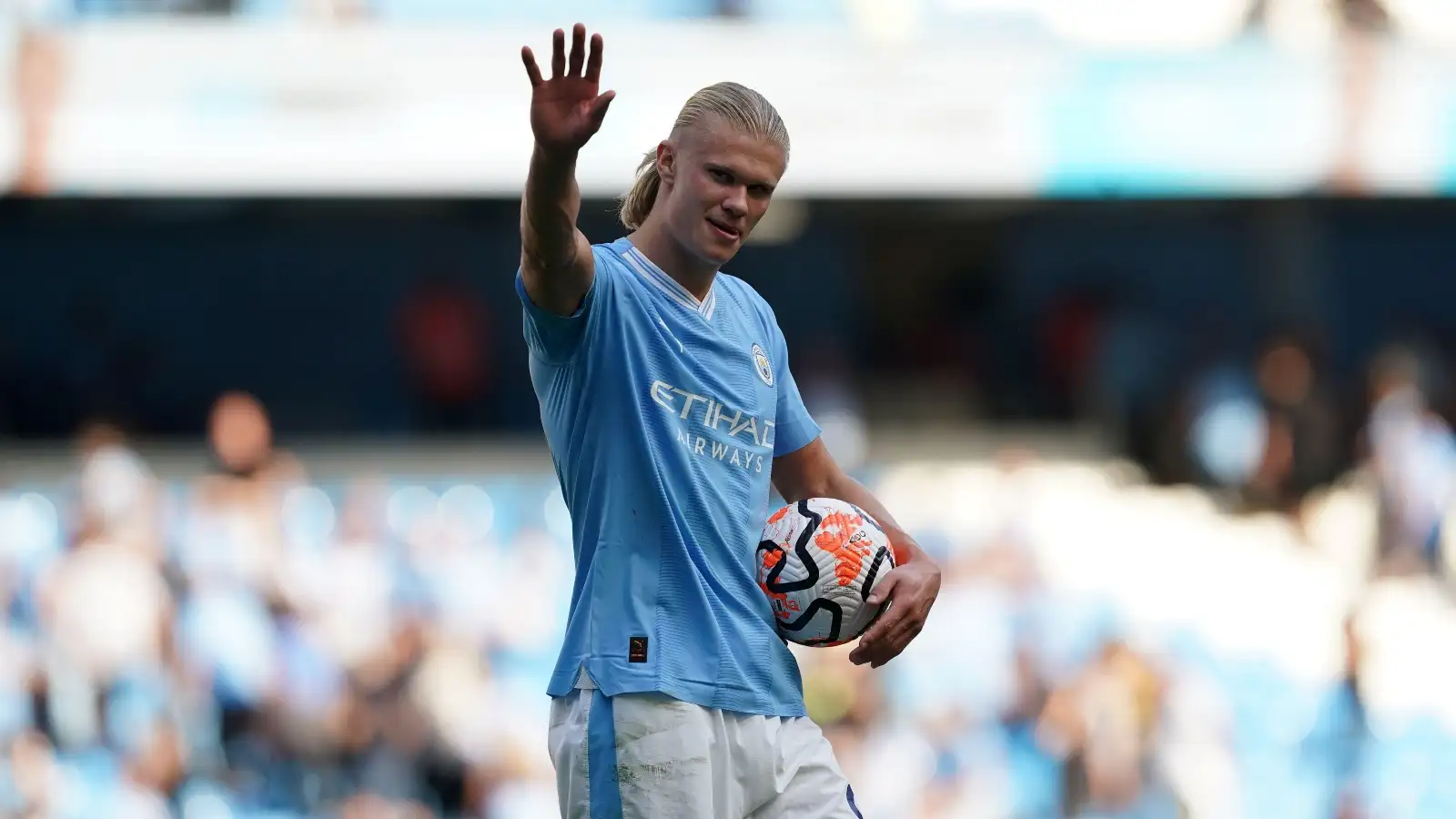 Manchester City's Erling Haaland celebrates with the match ball after scoring a hat-trick, following the Premier League match at the Etihad Stadium, Manchester. Picture date: Saturday September 2, 2023.