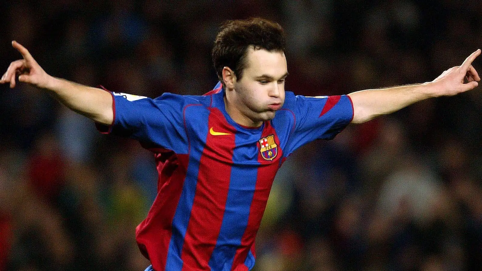 FC Barcelona player Andres Iniesta celebrates after scoring against Malaga during their League soccer match in Barcelona, Spain, Saturday, Dec. 4, 2004.