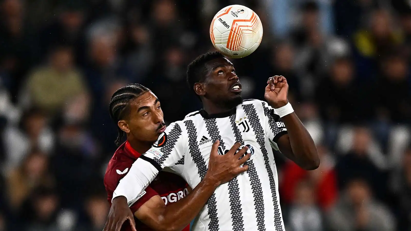 Turin, Italy. 11 May 2023. Paul Pogba of Juventus FC competes for the ball with Loic Bade of Sevilla FC during the UEFA Europa League semifinal first leg football match between Juventus FC and Sevilla FC.