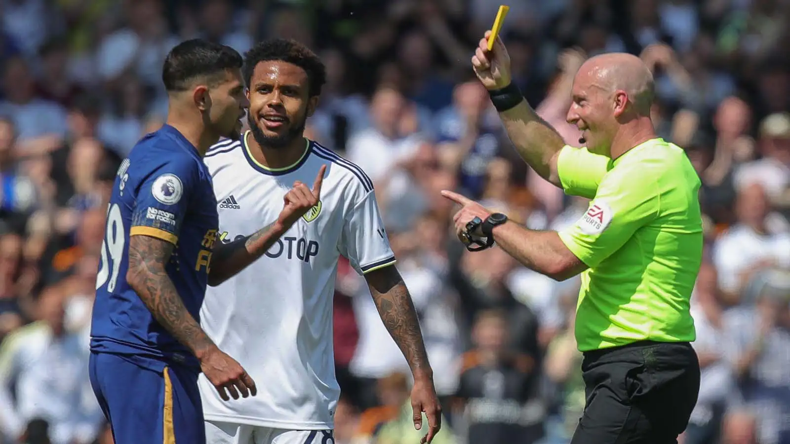 Referee Simon Hooper awards a yellow card to Bruno Guimarães #39 of Newcastle United for diving during the Premier League match Leeds United vs Newcastle United at Elland Road, Leeds, United Kingdom, 13th May 2023