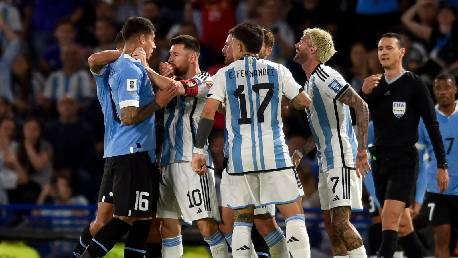 Argentina's Lionel Messi, second left, argues with Uruguay's Mathias Olivera, during a qualifying soccer match for the FIFA World Cup 2026 at La Bombonera stadium in Buenos Aires, Argentina, Thursday, Nov. 16, 2023.