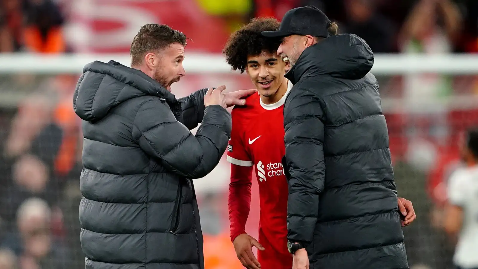 Luton Town manager Rob Edwards (left) and Liverpool manager Jurgen Klopp speak to Jayden Danns at the end of the Premier League match at Anfield, Liverpool.