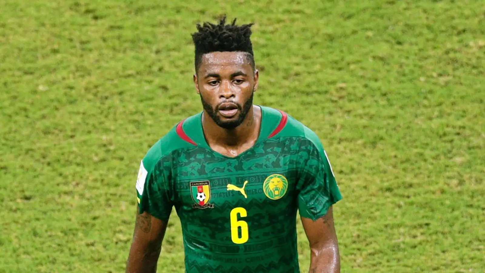 Cameroon's Alex Song leaves the pitch after being given a red card during the group A World Cup soccer match between Cameroon and Croatia at the Arena da Amazonia in Manaus, Brazil, Wednesday, June 18, 2014.