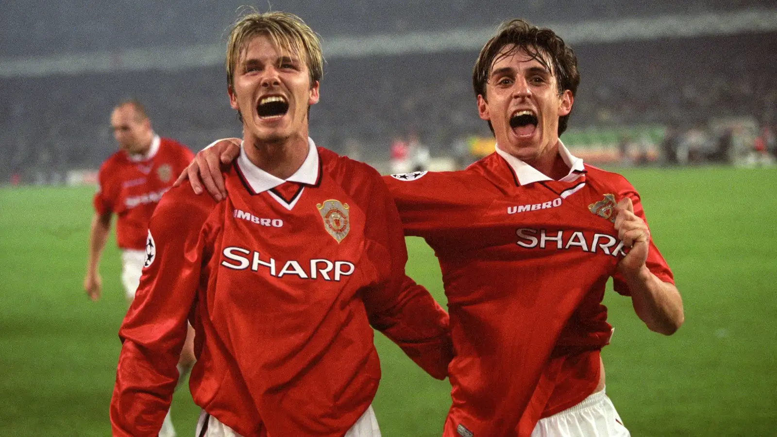 Manchester United's David Beckham and Gary Neville celebrate at the end of the UEFA Champions League semi-final victory over Juventus at Stadio Delle Alpi, Turin, Italy, April 1999.