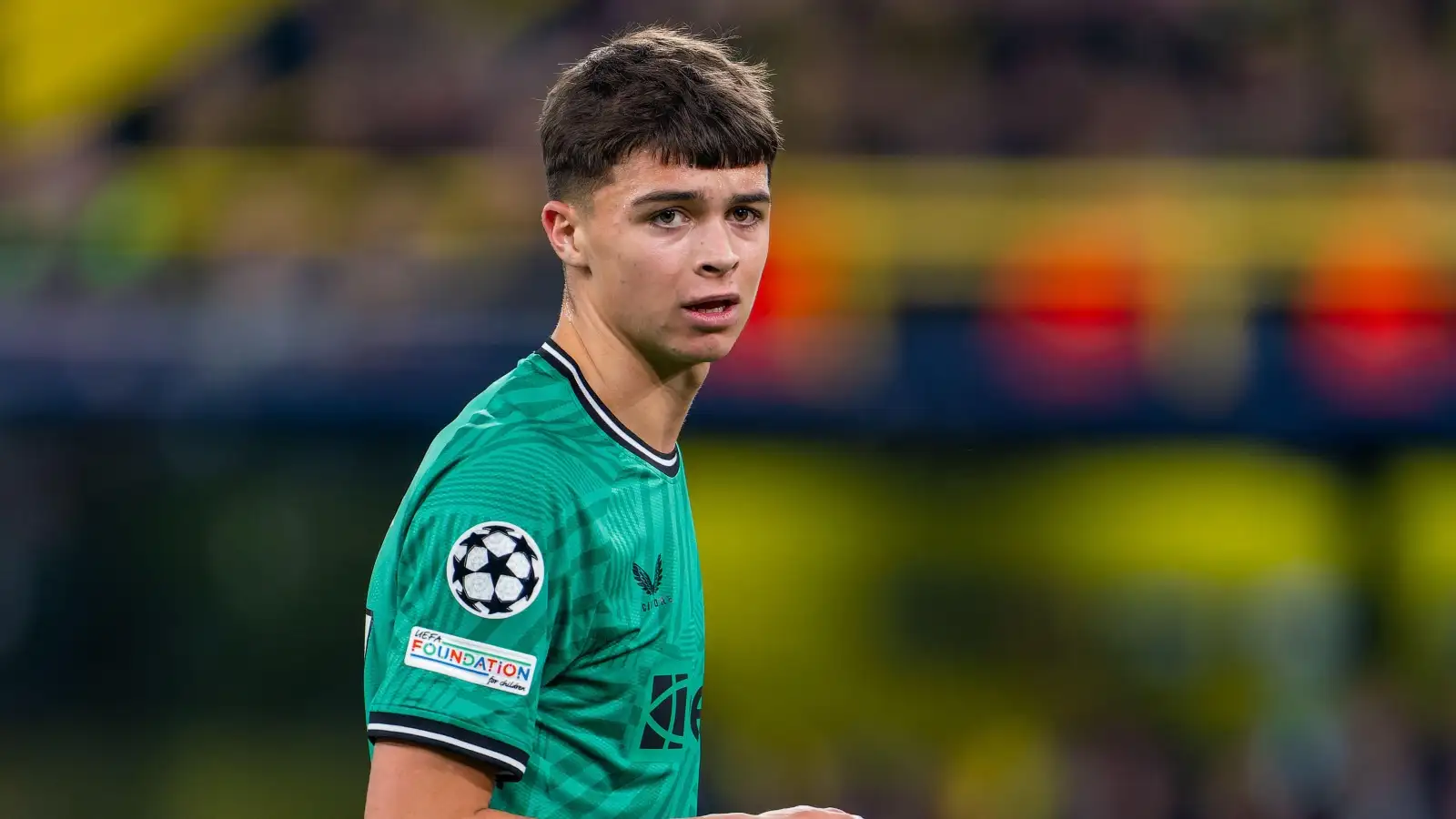 Lewis Miley of Newcastle United looks on during the UEFA Champions League Group F match between Borussia Dortmund and Newcastle United FC at the Signal Iduna Park on November 7, 2023 in Dortmund, Germany.