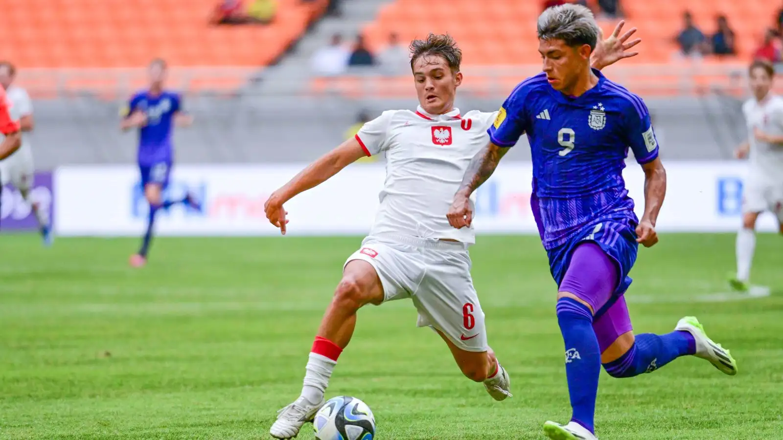 Agustin Ruberto (R) of Argentina competes with Maksymilian Sznaucner of Poland during the group D match of the FIFA World Cup U17 in Jakarta, Indonesia, Nov. 17, 2023.