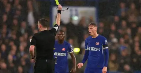 Cole Palmer of Chelsea is shown a yellow card