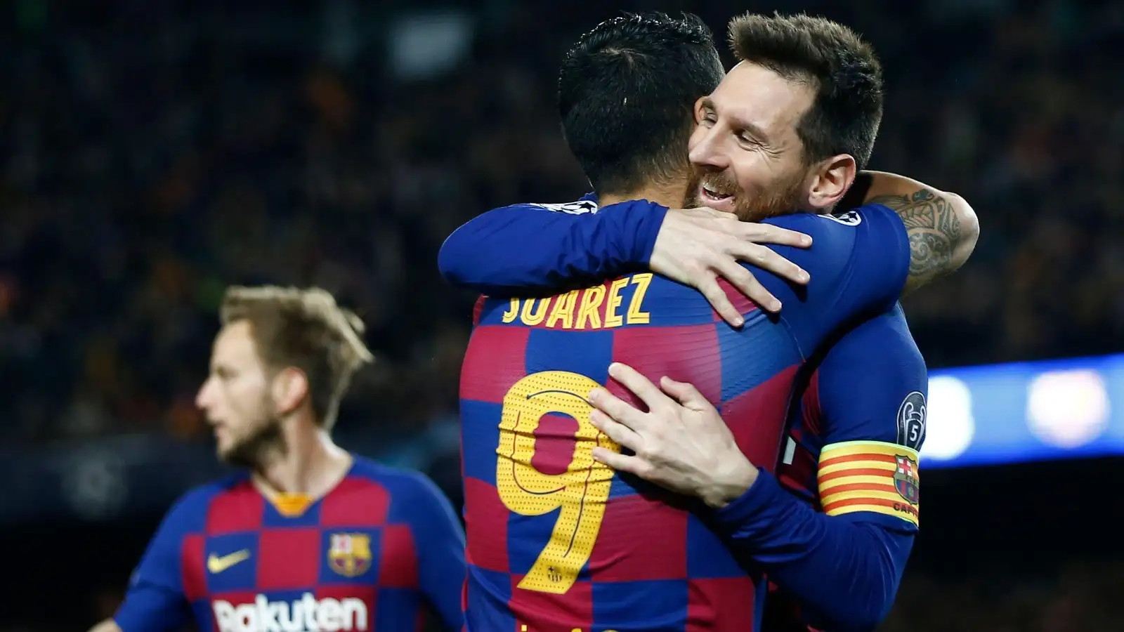 Barcelona's Luis Suarez is congratulated by Lionel Messi, right, after scoring the opening goal during a Champions League soccer match Group F between Barcelona and Dortmund at the Camp Nou stadium in Barcelona, Spain, Wednesday, Nov. 27, 2019.