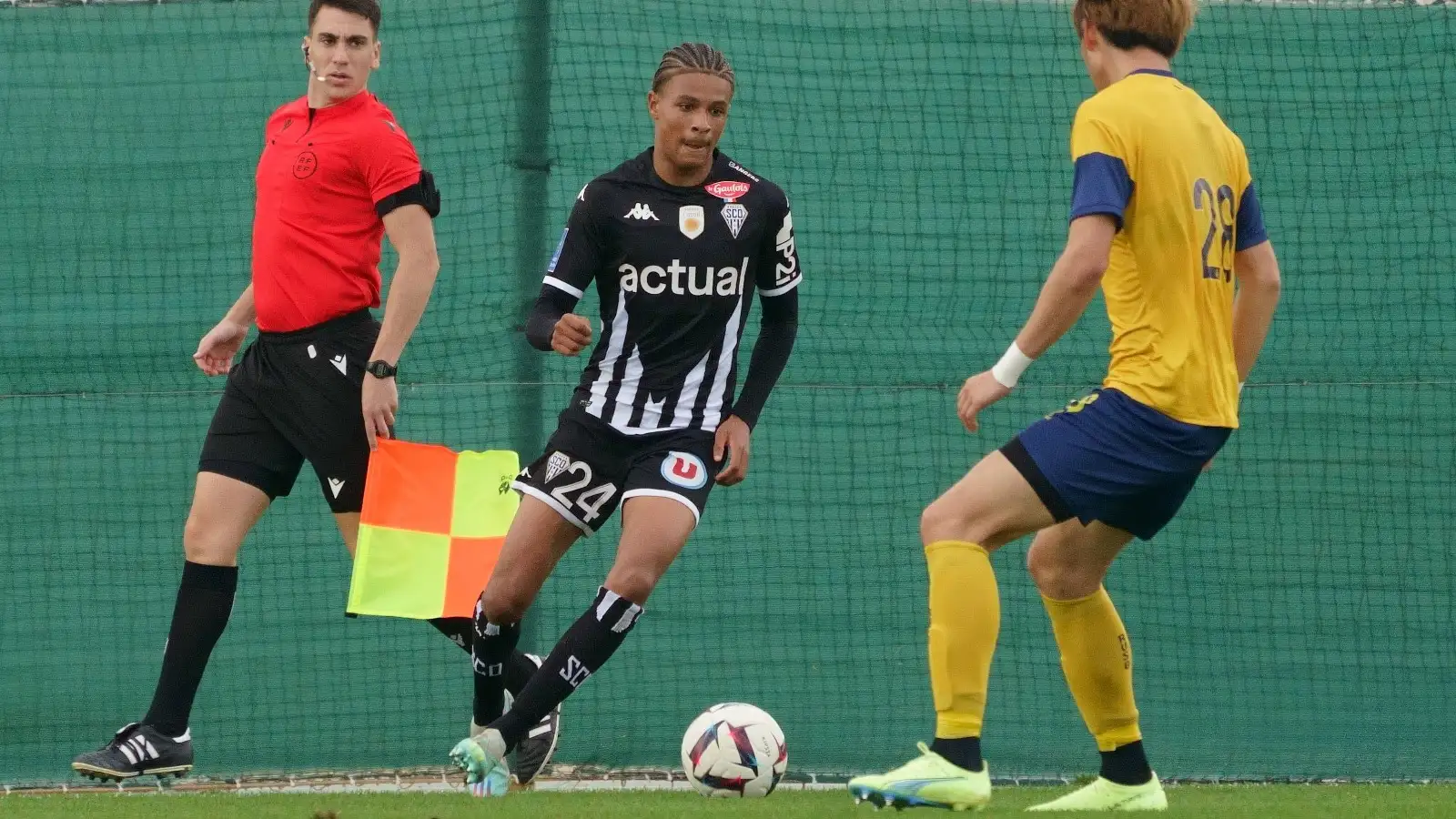 Angers' Jean-Matteo Bahoya and Union's Koki Machida pictured during a football match between Union Saint Gilloise et Angers SCO at the winter training camp of Belgian first division soccer team Royale Union Saint-Gilloise in Alicante, Spain, Thursday 08 December 2022.