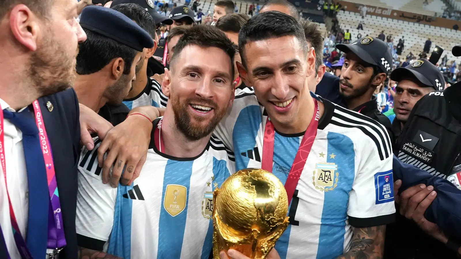 Argentina's Lionel Messi (left) and Angel Di Maria celebrate with the FIFA World Cup Trophy following victory over France via a penalty shootout in the FIFA World Cup Final match at the Lusail Stadium in Lusail, Qatar. Picture date: Sunday December 18, 2022.