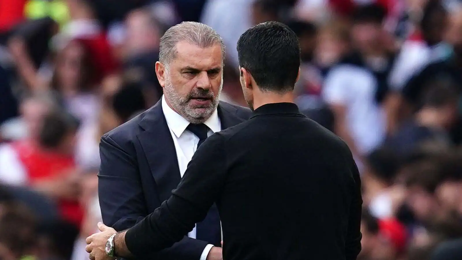 Ange Postecoglou (left) and Arsenal manager Mikel Arteta shake hands