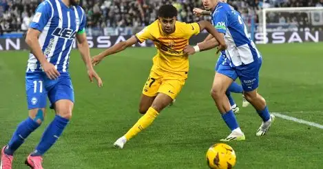 Barcelona's Lamine Yamal, centre, challenges for the ball with Alaves' Luis Rioja, left, and Alaves' Javi Lopez during the La Liga soccer match between Deportivo Alaves and FC Barcelona at the Medizorrosa stadium in Vitoria, Spain, Saturday, Feb. 3, 2024.