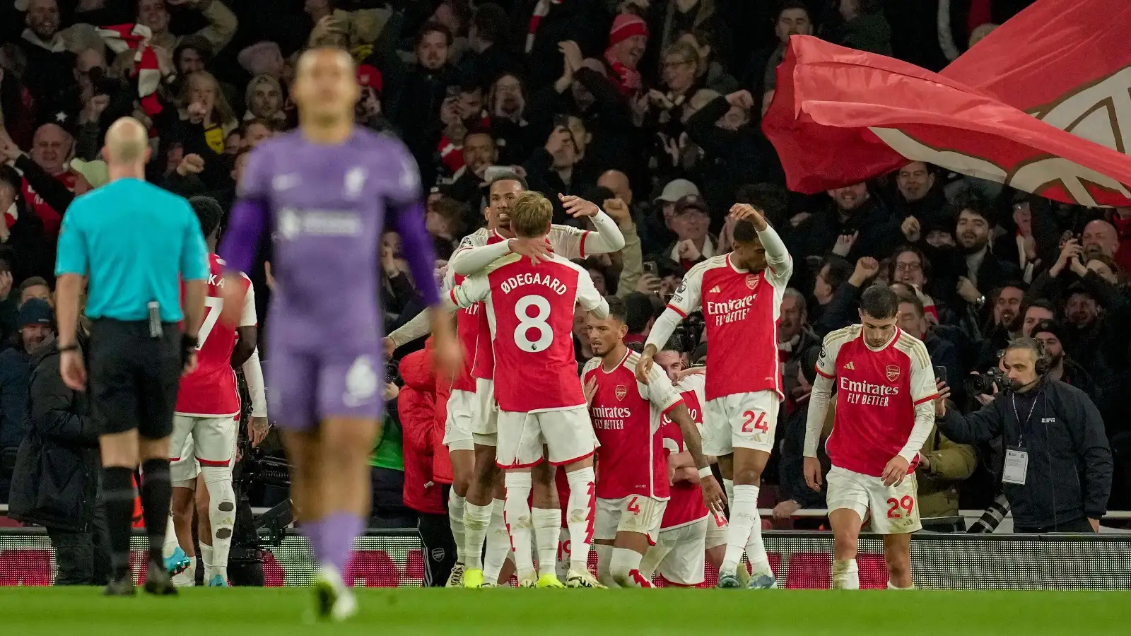 Arsenal players celebrate after their teammate Leandro Trossard scored their side's third goal during the English Premier League soccer match between Arsenal and Liverpool at Emirates Stadium in London,, Sunday, Feb. 4, 2024.