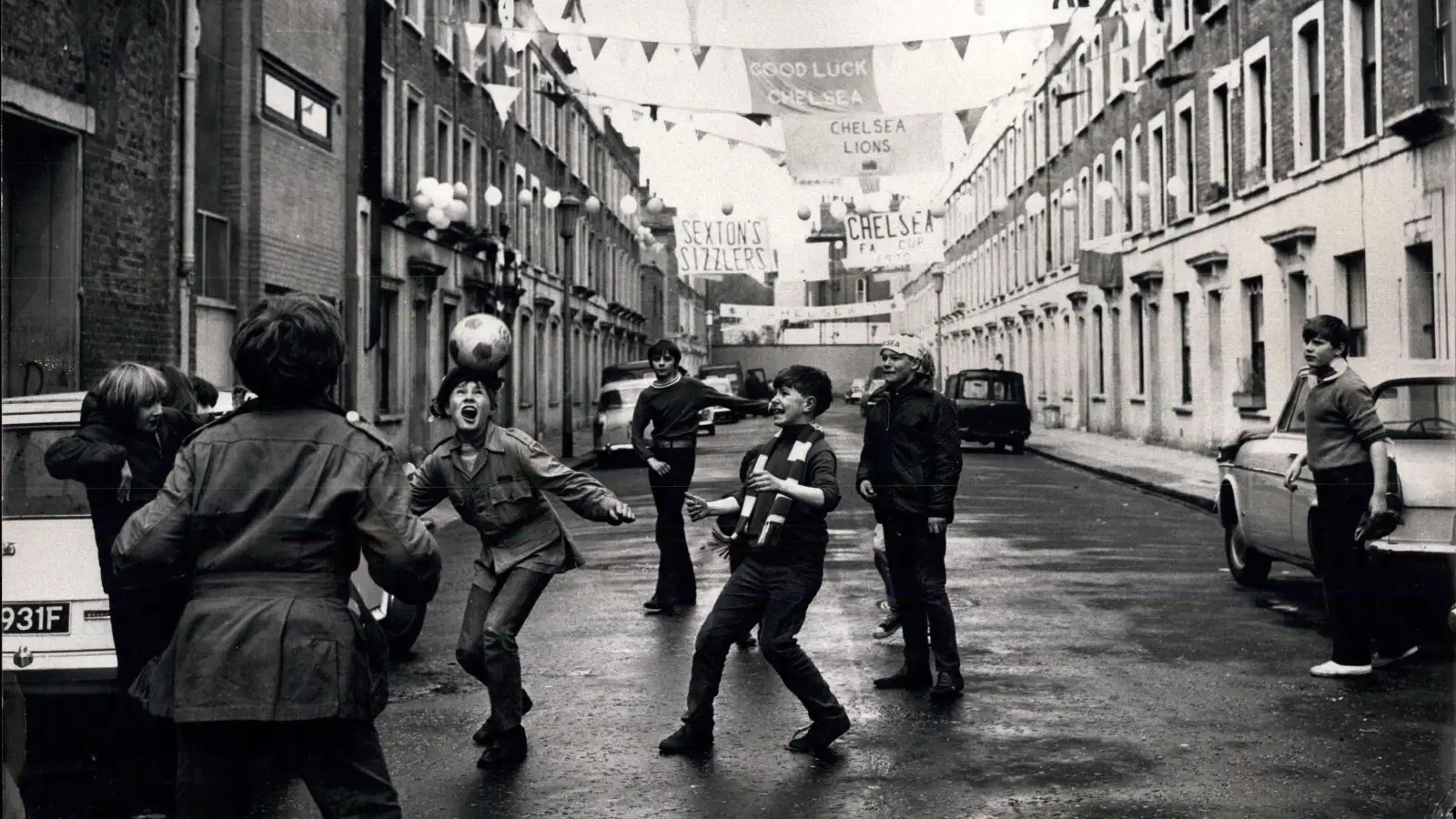 Apr. 10, 1970 - F.A. Cup fever in Chelsea: Chelsea meet Leeds United in tomorrow's F.A. Cup Final at Wembley - and cup fever has hit the borough of Chelsea. Beneath banners and bunting, these children stage an impromptu final in Slaidburn Street, Chelsea, today.