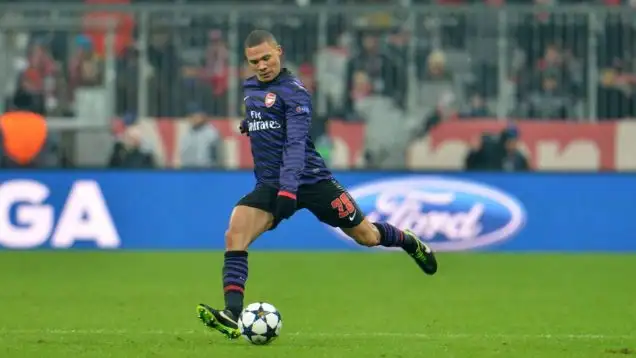 Arsenal's Kieran Gibbs goes with the ball during the Champions League round of 16 second leg soccer match between FC Bayern Munich and FC Arsenal in Munich, Germany, Wednesday, March 13, 2013.