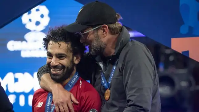 Jurgen Klopp celebrates winning the Champions League with his top goalscorer at Liverpool.