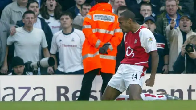 Thierry Henry celebrates scoring against Tottenham in 2002.