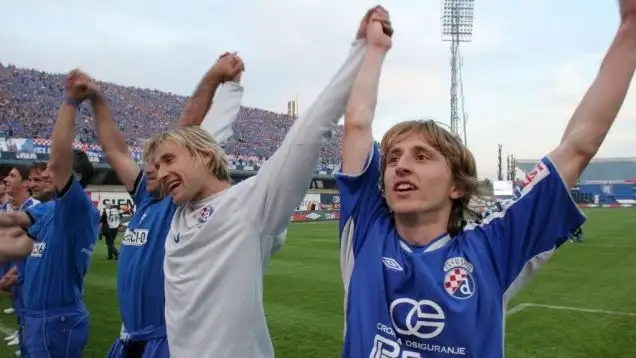Ivan Bosnjak, left, and Luka Modric, right, of Dinamo Zagreb celebrate at Maksimir stadium in Zagreb, Croatia Saturday, May 13, 2006, after Dinamo won the national soccer championship by beating rivals Hajduk of Split 1-0