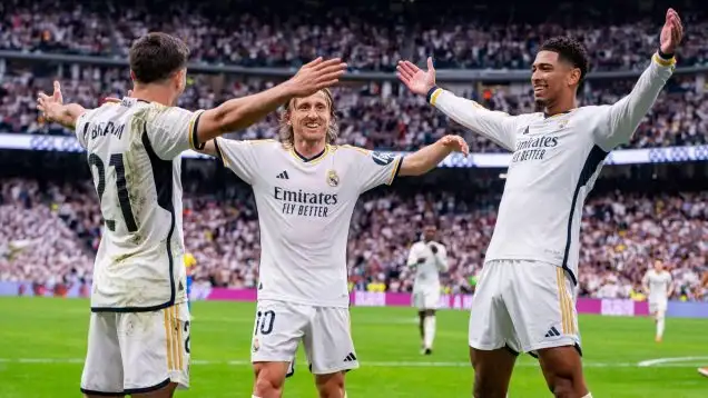 Real Madrid players, including Luka Modric and Jude Bellingham, celebrate another title success.