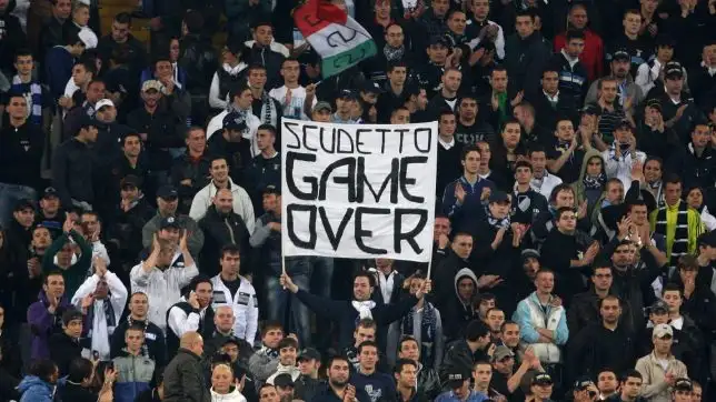 Lazio fans taunt Roma fans.