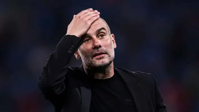 Pep Guardiola, head coach of Manchester City, reacts